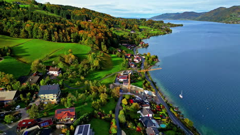 Iconic-township-on-Attersee-lake-coastline,-aerial-view
