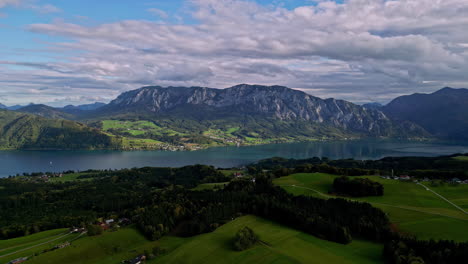 Attersee-lake-with-mountains-in-background,-aerial-view