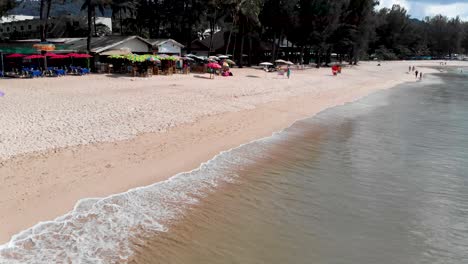 Calm-waves,-sandy-laguna-beach-in-Thailand,-Establish-shot-in-SE-Asia,-4K-Droneshot