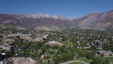 City-of-Alpine,-Utah-with-autumn-colored-mountainside,-Drone-dolley