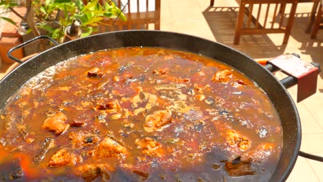 Close-up-shot-of-traditional-paella-rice-popular-been-cooked-on-a-gas-stove-in-the-Spanish-town-of-Valencia