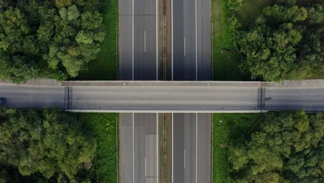 Car-passing-the-bridge-above-the-highway