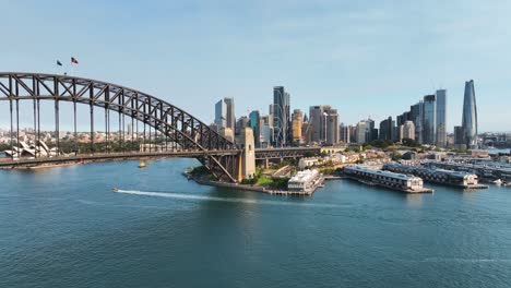 Aerial-View-Of-Sydney-Harbour-Bridge-Panning-to-Sydney-CBD-And-Darling-Harbour-At-Sunset,-Australia