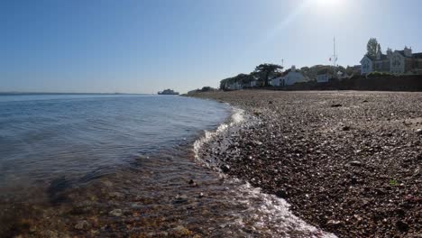 Cristal-clear-water-waves-gently-kissing-the-orange-pebble-beach-in-the-Isle-of-Wight
