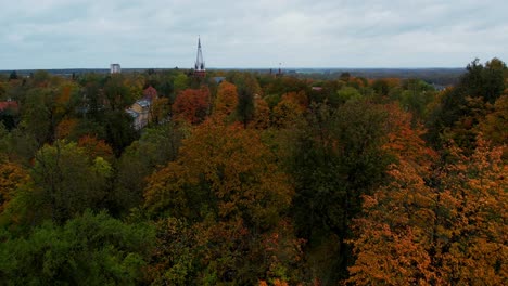 Calming-drone-shot-over-Toome-hill-Park-in-Tartu-during-autumn-when-all-treas-are-beatiful