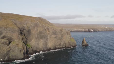 Aerial-flight-of-along-rocky-coastline-with-Ketubjorg-cliifs-during-sunny-day-on-Iceland