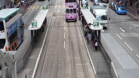 Double-decker-trams-traffic-density-on-busy-Kings-Road