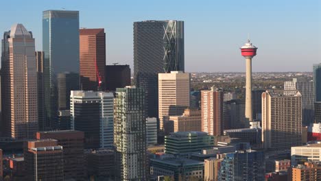A-aerial-drone-turns-in-on-the-downtown-core-focusing-on-the-Calgary-tower-on-a-beautiful-sunny-summer-day