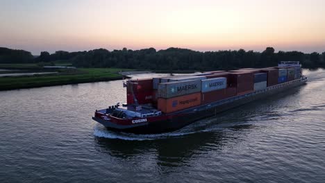 Netherlands-Shipping:-'Cugini'-on-the-River-at-Dusk