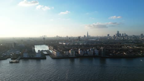 Aerial-view-over-River-Thames-and-Surrey-Docks-in-Rotherhithe,-London