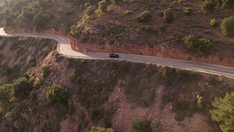 Honda-Civic-Type-R-Black-Car-Driving-Along-Remote-Mountain-Pass-and-Steep-Gradient-Road,-Aerial-View