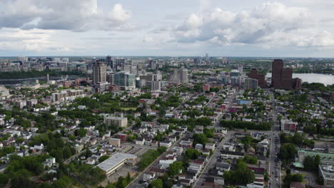 Aerial-view-backwards-away-from-the-skyline-of-Gatineau,-summer-day-in-Canada