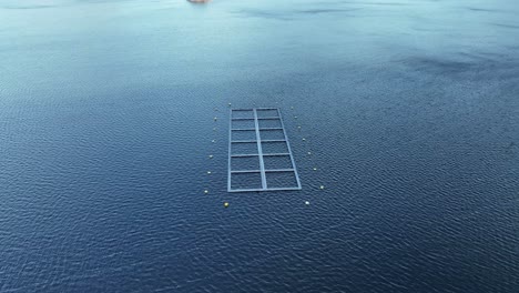 Norway-square-fish-farm,-aerial
