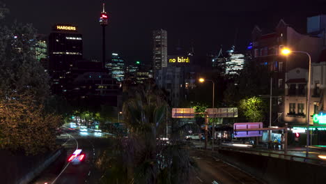 Nighttime-traffic-time-lapse-at-William-Street-at-the-entrance-of-the-Cross-City-Tunnel-in-Kings-Cross,-Sydney,-Australia