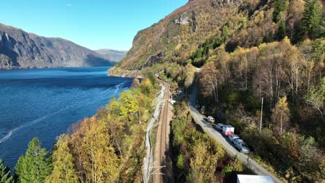 Aerial-above-scenic-Bergensbanen-railway-between-Vaksdal-and-Stanghelle,-Norway