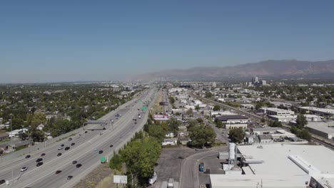 Traffic-on-Interstate-15-freeway-in-salt-lake-county-on-a-sunny-day,-aerial