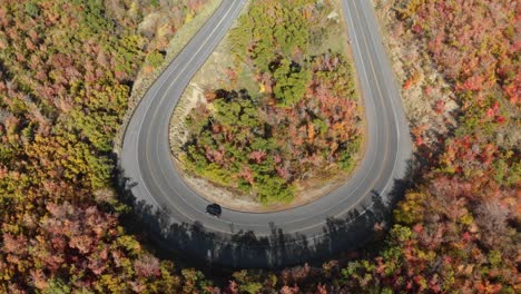 Top-down-aerial-of-cars-on-Emigration-Canyon-road-loop-during-fall-Utah,-USA