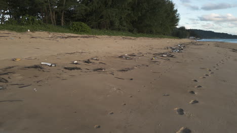 Rubbish-washed-out-on-the-beach,-slowly-turning-into-microplastics