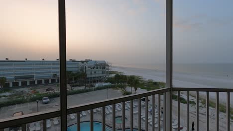 TimeLapse:-Sunrise-from-balcony-overlooking-beachside-resorts-and-coast