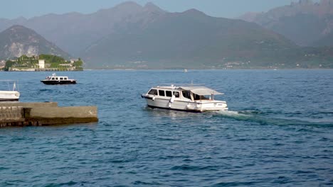 A-small-sightseeing-boat-on-its-way-to-its-docking-point-in-the-port-of-Stresa