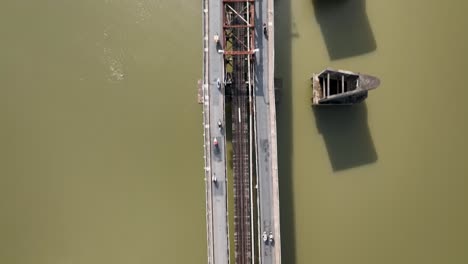 Residents-commuting-along-the-imposing-Long-Bien-bridge-in-Hanoi,-aerial