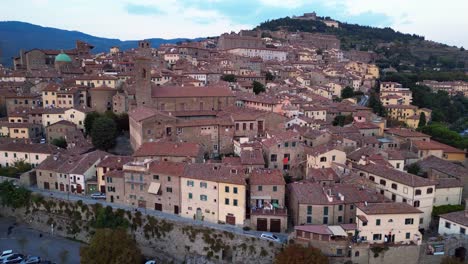 Dramatic-aerial-top-view-flight-Historical-Hill-Town-Cortona-Tuscany-Arezzo-Italy