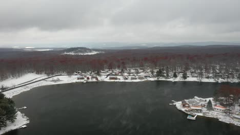 Foggy-Winter-Lake-in-Snowy-Woods---Drone-Countryside-Footage