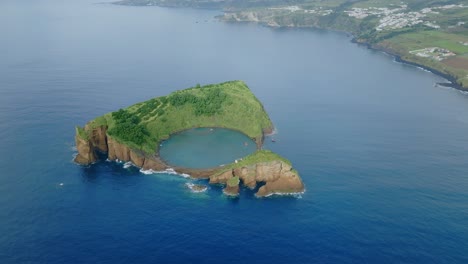 Aerial-drone-shot-of-small-tropical-island-located-in-Sao-Miguel,-Azores