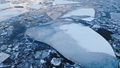 A-drone-flying-above-colossal-ice-masses-on-the-water's-surface
