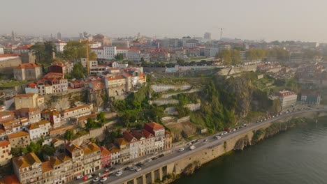 Aerial-drone-shot-of-riverside-houses-in-Porto-city-with-houses-and-river---sunny-morning