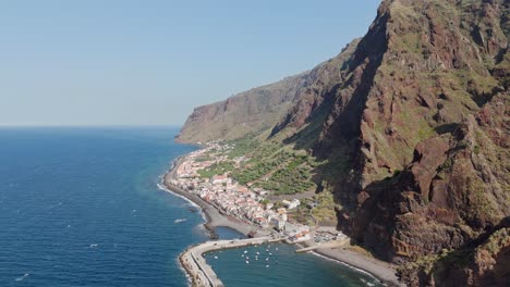 Aerial-shot-of-residential-housing-and-seascape-in-Paul-do-Mar,-Madeira-island,-Portugal