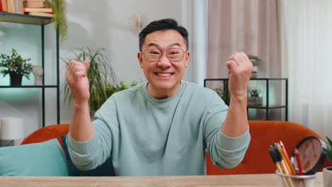 Excited-happy-Asian-man-surprised,-shocked-by-sudden-victory-good-win-news-celebrate-wow-reaction