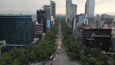 Frontal-drone-video-of-the-famous-Angel-of-Independence-monument,-situated-on-the-renowned-Paseo-de-la-Reforma-avenue-in-Mexico-City