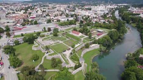 Banja-Luka's-Kastel-Fortress-by-the-Vrbas-River,-aerial-of-cityscape,-Bosnia