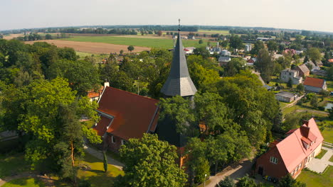 Aerial-shot-of-beautiful-medieval-church-in-Trutnowy,-Poland