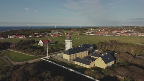 Hanstholm-Fyr,-Thisted,-Denmark---Lush-Foliage-Envelops-the-Lighthouse---Drone-Orbit