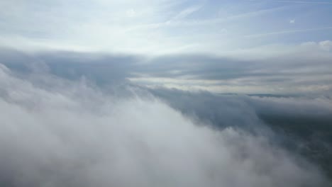 Aerial-view-flying-over-a-layer-of-textured-clouds