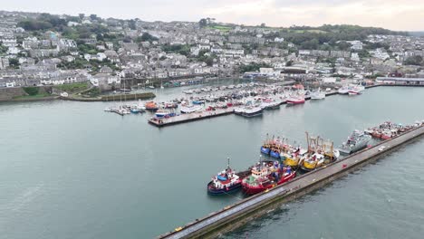 Newlyn-harbour-Cornish-fishing-port-pull-back-drone-aerial-reverse-reveal