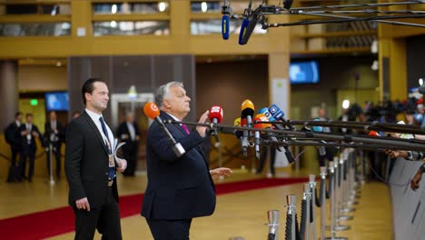 Hungarian-Prime-Minister-Viktor-Orbán-discussing-with-the-international-press-at-the-European-Council-conference-in-Brussels,-Belgium---Slow-motion