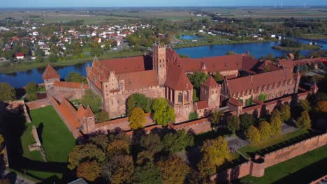 Aerial-4K-drone-video-of-beautiful-red-brick-Malbork-Castle,-Poland---near-Gdansk