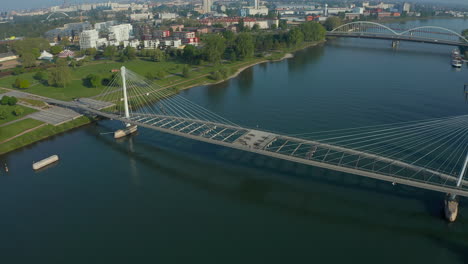 Tracking-shot-a-bridge-over-the-river-Rhine-connecting-France-with-Germany-at-summer