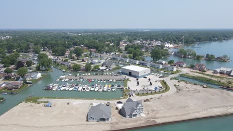 Beautiful-lake-town-with-private-estates-and-commercial-buildings,-aerial-view