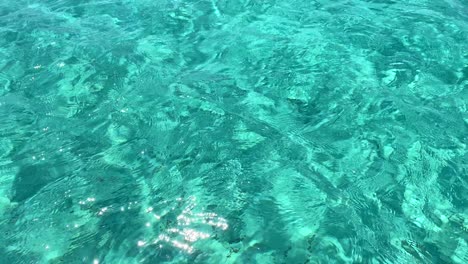 Crystal-clear-transparent-turquoise-water,-summer-dream-vacation-destination-in-Formentera-island-Ses-Illetes-beach-Ibiza-Spain,-4K-shot