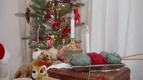 Cozy-Christmas-corner-with-festive-tree-and-knitting-setup