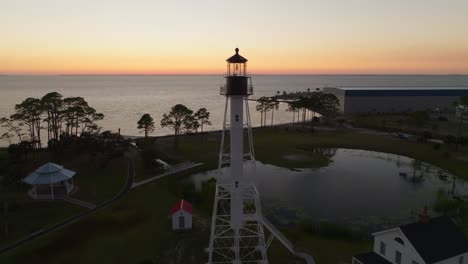 Drone-orbit-of-sunset-and-beautiful-ocean-views-behind-Cape-San-Blas-Lighthouse-in-Port-St