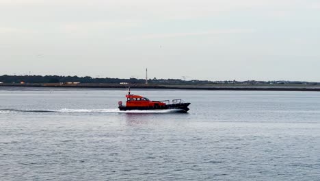 Seafaring-Serenity:-Handheld-Following-Shot-of-DPC-Tolka-Leaving-Dublin-Port-in-the-Evening