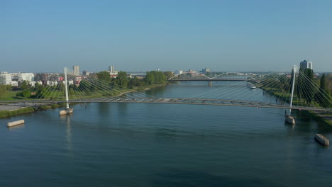 Approaching-shot-of-a-bridge-over-the-river-Rhine-connecting-France-with-Germany-at-summer