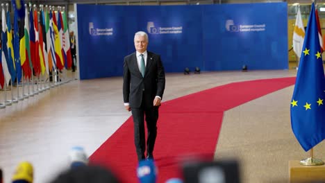 Lithuanian-President-Gitanas-Nausėda-arriving-on-the-red-carpet-at-the-European-Council-summit-in-Brussels,-Belgium---Slow-motion