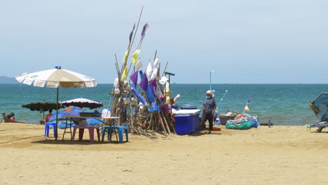 Fisherfolks-preparing-for-fishing-expedition-under-a-hot-sun-and-windy-climate-on-a-sandy-beach