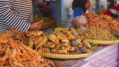 Close-up-shot-of-crispy-fried-sea-food-selling-on-street-market,slow-motion